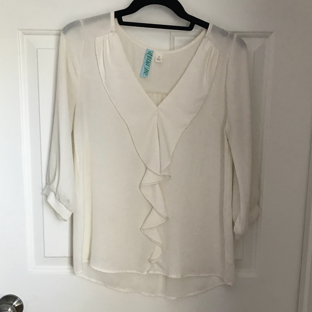Semi sheer white ruffled blouse